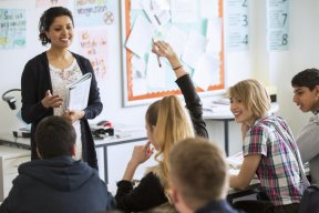teacher teaching teens in class